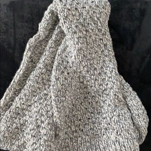 Gray and white knitted scarf.